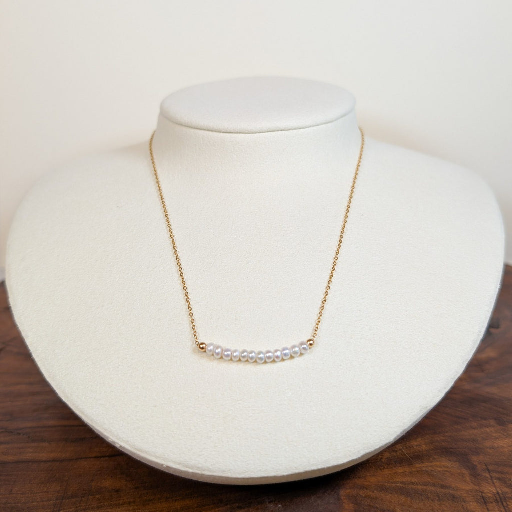 June pearl birthstone necklace on a jewelry display bust