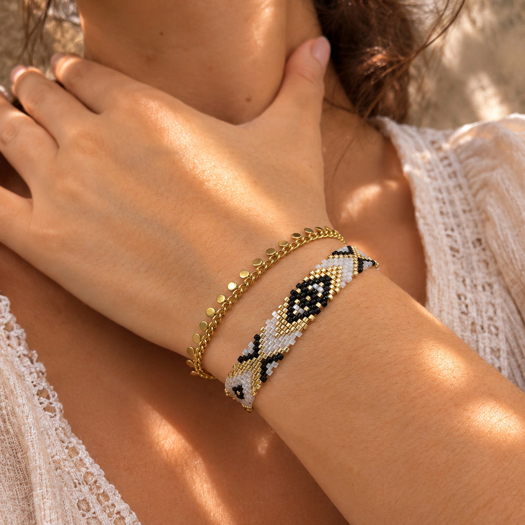 Close-up of the Woven Roots Ivory handwoven Miyuki bracelet on the wrist