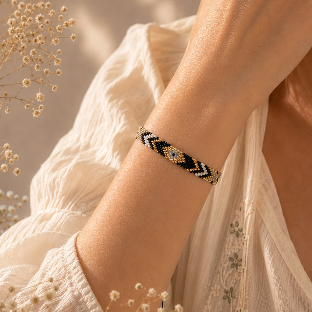 Model wearing the Woven Roots Onyx handwoven Miyuki bracelet