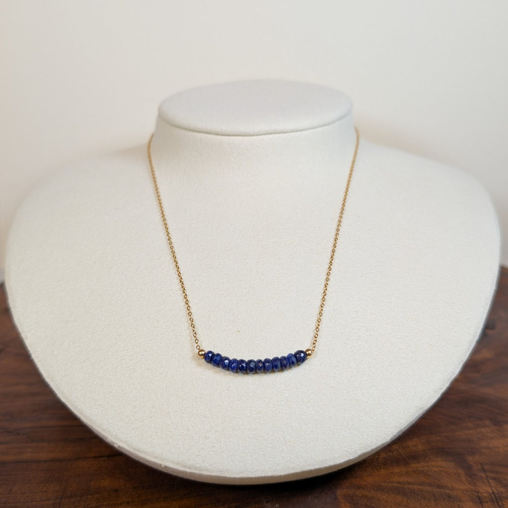 September sapphire birthstone necklace on a jewelry display bust